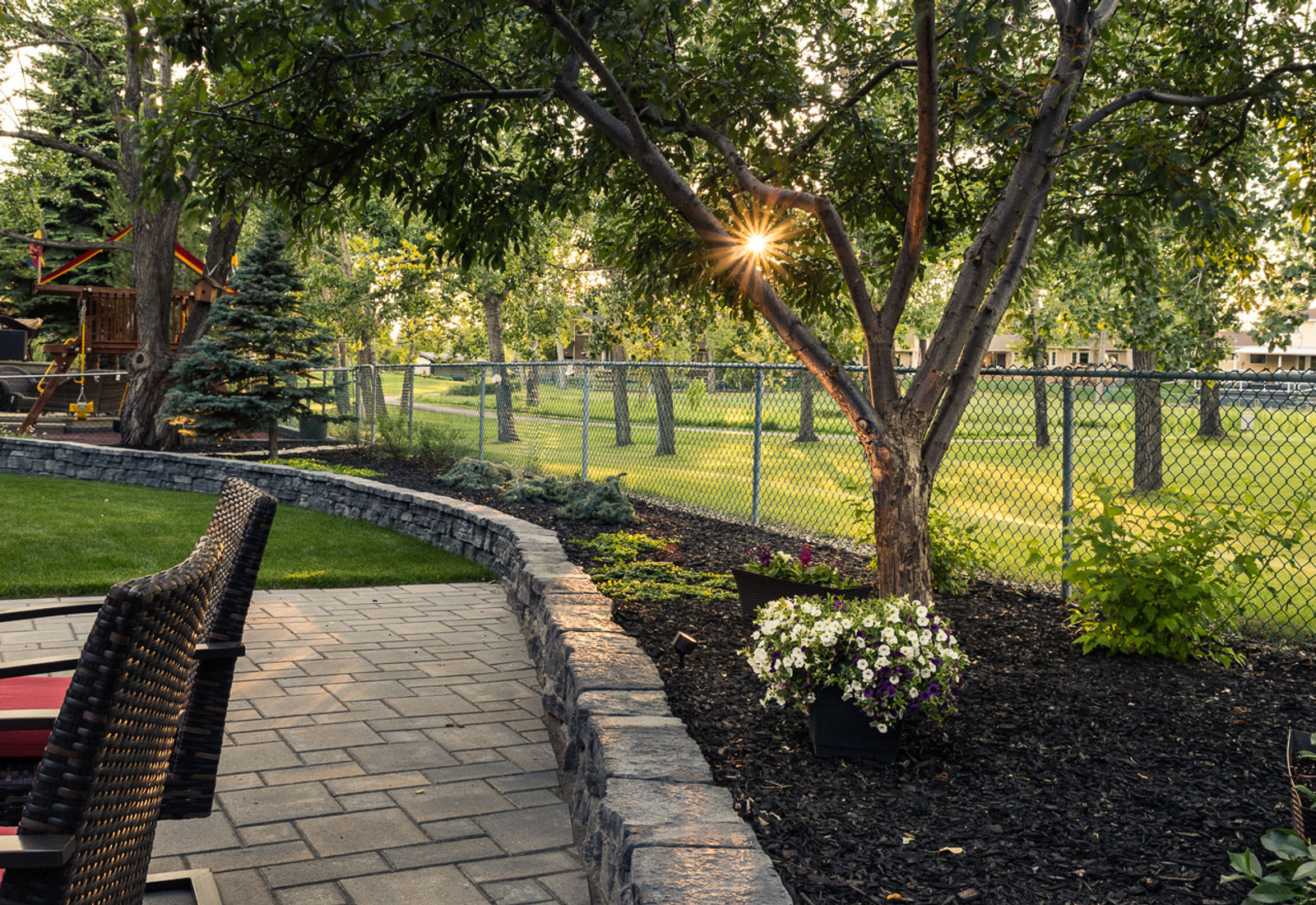 Stone retaining wall and planting built by Year-Round Landscaping